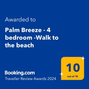 a yellow sign with the words walk to the beach at Palm Breeze - 4 bedroom -Walk to the beach in Bargara