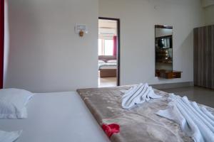 Ένα ή περισσότερα κρεβάτια σε δωμάτιο στο Hotel Nilkantha