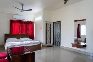Ένα ή περισσότερα κρεβάτια σε δωμάτιο στο Hotel Nilkantha