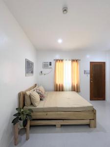 a bedroom with a bed in a room at Sunnydale Apartelle -Room Accommodation near Calatagan Beach Resorts in Batangas City +11 photos
