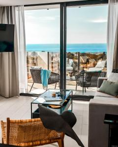 a living room with a view of the ocean at HO Aguadulce in Aguadulce