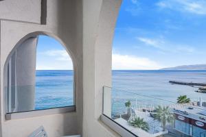 a view of the ocean from a building at Glaros Beach Hotel in Hersonissos
