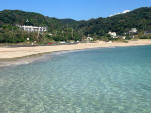 a view of a beach and the ocean at Aqua Beach House Sotoura - 1min walk to Sotoura Beach! in Shimoda