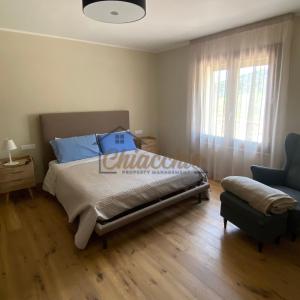 Un pat sau paturi într-o cameră la Villa La Macchia