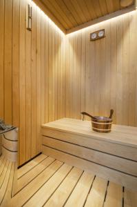 a sauna with a copper tub on a wooden floor at Villa Astera near Poreč for 8 people with infinity pool, whirlpool & sauna in Višnjan