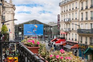 a view of a city street with buildings at ibis Paris Gare du Nord TGV in Paris
