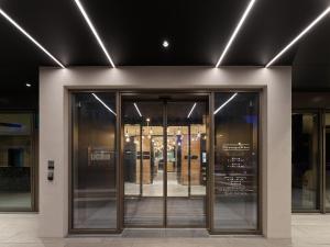 an entrance to a store with glass doors and lights at Lukullum in Friedrichshafen