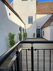 a balcony with a railing next to a building at 7 Plants Yard in Worksop