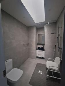 a bathroom with a toilet and a sink at Welcome to DC's Cottage in Holycross