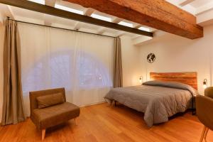 Ένα ή περισσότερα κρεβάτια σε δωμάτιο στο Sette Chiese Apartments