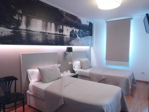 Postel nebo postele na pokoji v ubytování Hello Villarreal Suites
