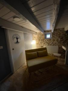 a living room with a couch and a table at Séjour à la Marronnie in Saint-Germain-les-Vergnes +1 photo