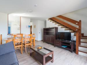 a living room with a couch and a table at Casa Joral, para surfear en Famara in Famara