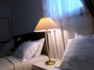 Postel nebo postele na pokoji v ubytování Chateau Linza Resort