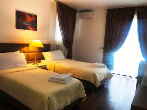 Postel nebo postele na pokoji v ubytování Chateau Linza Resort