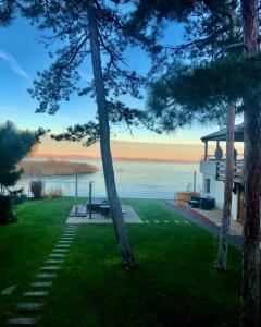 a house with a view of the water at Royal Mediterran in Siófok