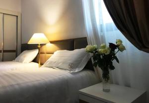Postel nebo postele na pokoji v ubytování Chateau Linza Resort