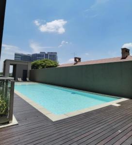 a swimming pool on the roof of a building at Love Luxe @ Sandton skye in Johannesburg