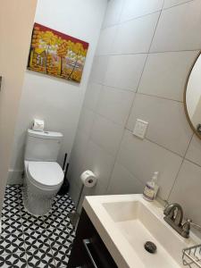 a bathroom with a white toilet and a sink at Charming apt in Pacific Heights in San Francisco