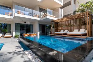 a swimming pool in the middle of a house at GuestReady - Private Pool at the FIVE in Dubai