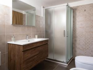 a bathroom with a sink and a shower at Relais San Martino Salento - Handwritten Collection in Taviano