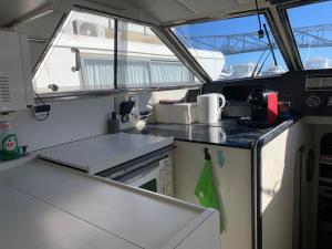 a kitchen on a boat with a counter top at Barco Barcelona in Barcelona