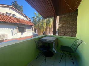 a balcony with a table and two chairs on it at Camel Hotel & Apart in Antalya