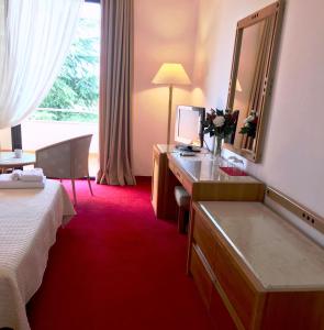 Postel nebo postele na pokoji v ubytování Chateau Linza Resort