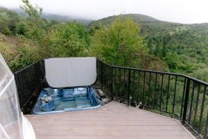 a bath tub sitting on top of a balcony at Dream Domes Glamping in Gabala