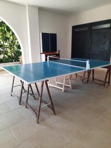 a ping pong table sitting on top of a floor at B&B Costa Gentile in Taranto