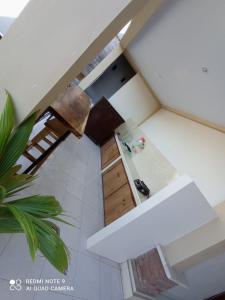 an overhead view of a kitchen with a white counter top at Spacious Room Jimbaran in Jimbaran