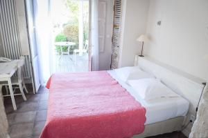 Postel nebo postele na pokoji v ubytování Le Lodge Kerisper
