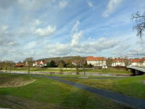 a bridge over a road in a city at Hotel zum Rücking in Northeim