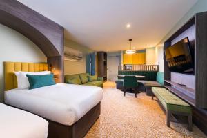 Ένα ή περισσότερα κρεβάτια σε δωμάτιο στο Hotel Killarney