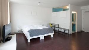 Łóżko lub łóżka w pokoju w obiekcie Stanys - Das Apartmenthotel