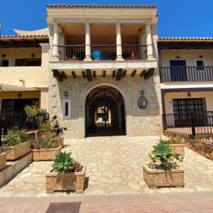 a large building with a balcony and a courtyard at Luxury penthouse Apartment in Cuevas del Almanzora