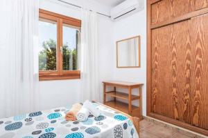 Postel nebo postele na pokoji v ubytování Cal Berros