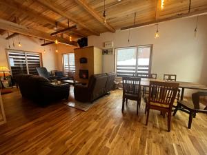 a large living room with a table and chairs at Anaba Lodge 