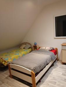 Ein Bett oder Betten in einem Zimmer der Unterkunft Maison au calme et proche de la mer