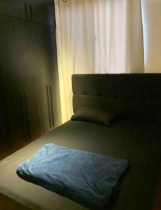 מיטה או מיטות בחדר ב-Apartamento Cuiabá