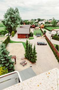 a view of a park with a car parked in a parking lot at Baltic Summer - ośrodek dla rodzin z dziećmi in Rewa