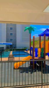 a painting of a playground with a pool at Apartamento Cuiabá in Cuiabá