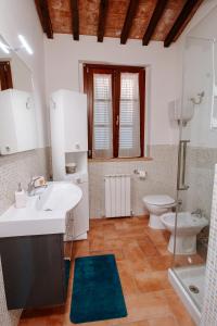 a bathroom with a sink and a toilet at Agriturismo Il Sogno in Castiglione del Lago