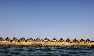 a row of huts on a island in the water at Westpoint Dakhla in Dakhla