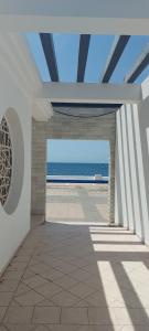 an empty hallway with a view of the ocean at LAS OLAS ATICO PENHOUSE with TERRACE and SEA VIEW, 2 bedrooms in La Caleta