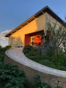a house with a walkway in front of it at Le Gîte des Alleux in Saint-Julien