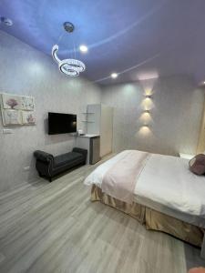 Voodi või voodid majutusasutuse 屏東潮州民宿-綠品文旅Green Inn toas