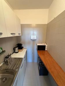 Kuchyň nebo kuchyňský kout v ubytování Venice Rooms