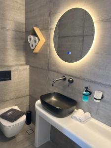 Ванная комната в SOPHILIA SUITES