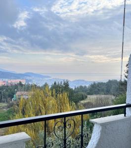 a balcony with a view of the mountains at Philoxenia in Kavála